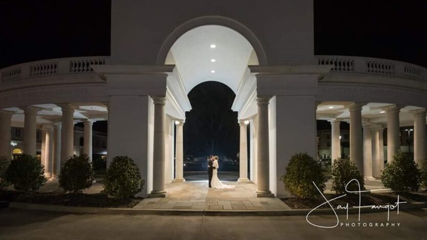 Wedding couple under the arches of The Colonnade at night time - Parc Lafayette - Outdoor Wedding Venues