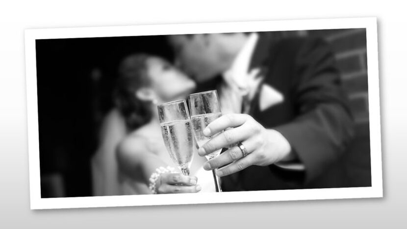 Image of a bridge and groom engaged in a kiss toasting with champagne -  private event venues - Le Pavillon